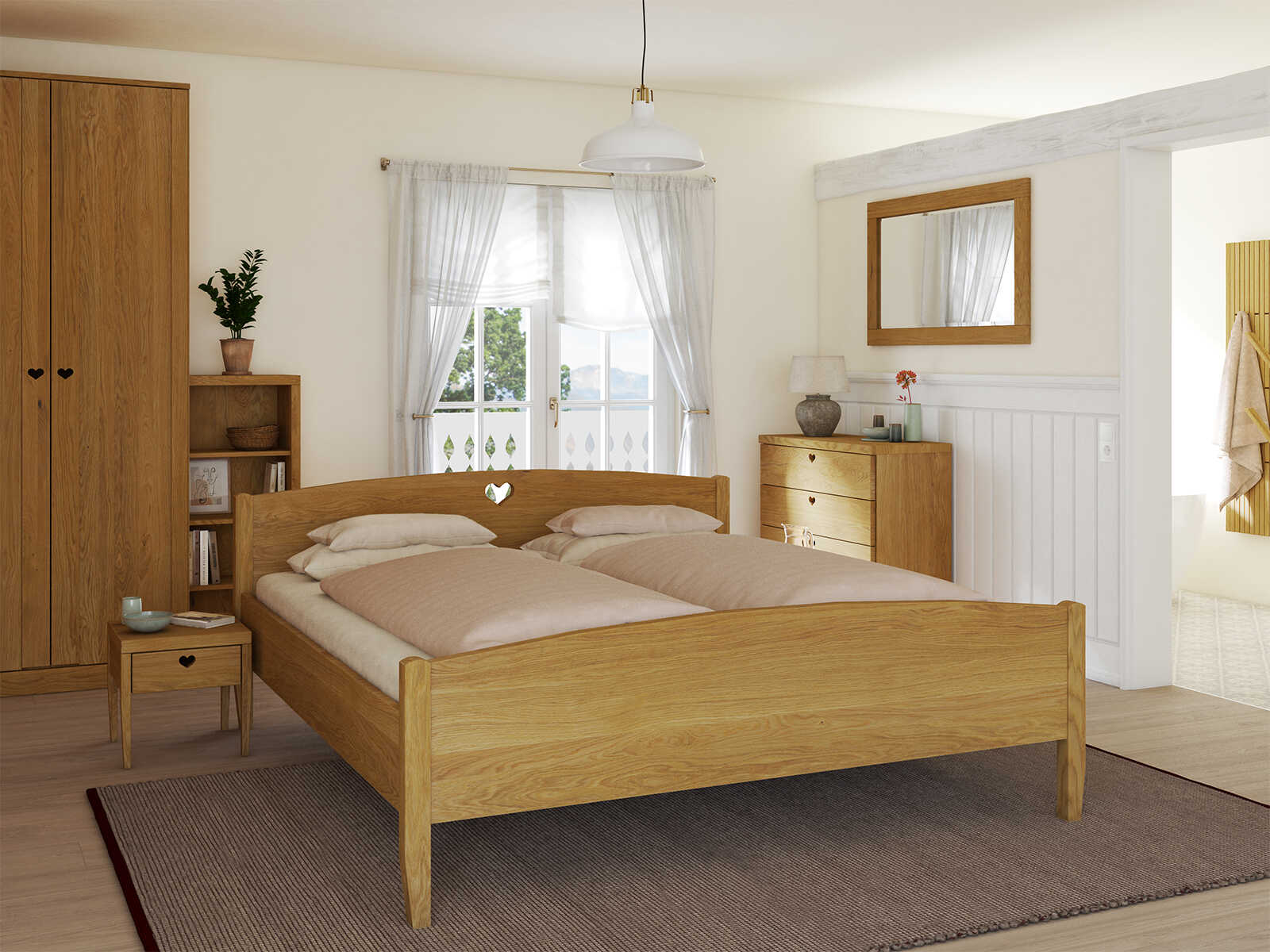 Schlafzimmer mit Eichenbett „Heidi“ in 180 x 200 cm mit niedrigem runden Fußteil und mit Kopfteil „Herz“