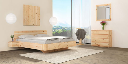 Zirbenschlafzimmer mit Zirbenholzbett